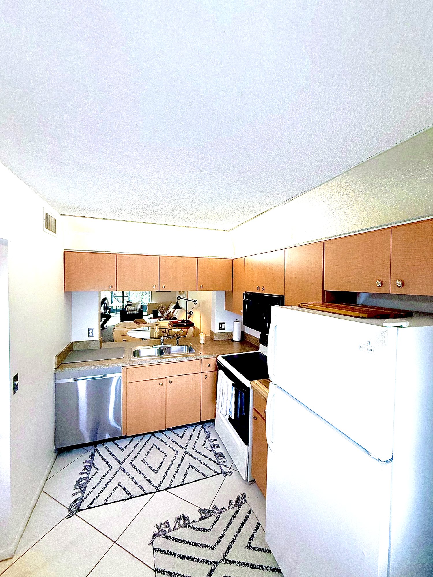 Full kitchen with stainless dishwasher, range and generous cabinetry